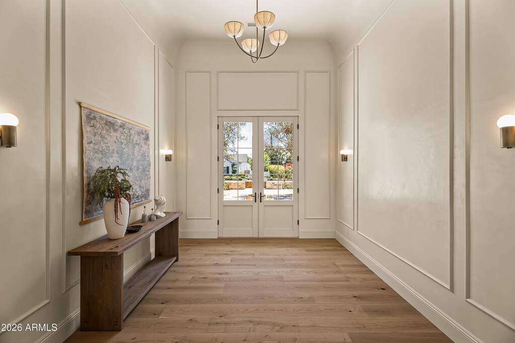 Foyer with Custom Molding, Roman Clay Paint, and Designer Lighting