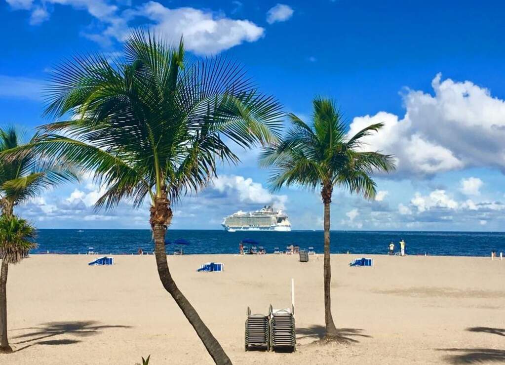 Lounge chairs and umbrellas provided by beach atte