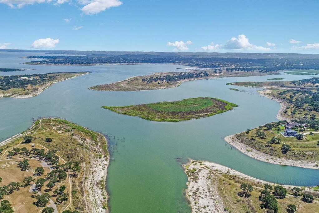 Canyon Lake wraps around the 10  acre property making it feel like the whole cove is yours