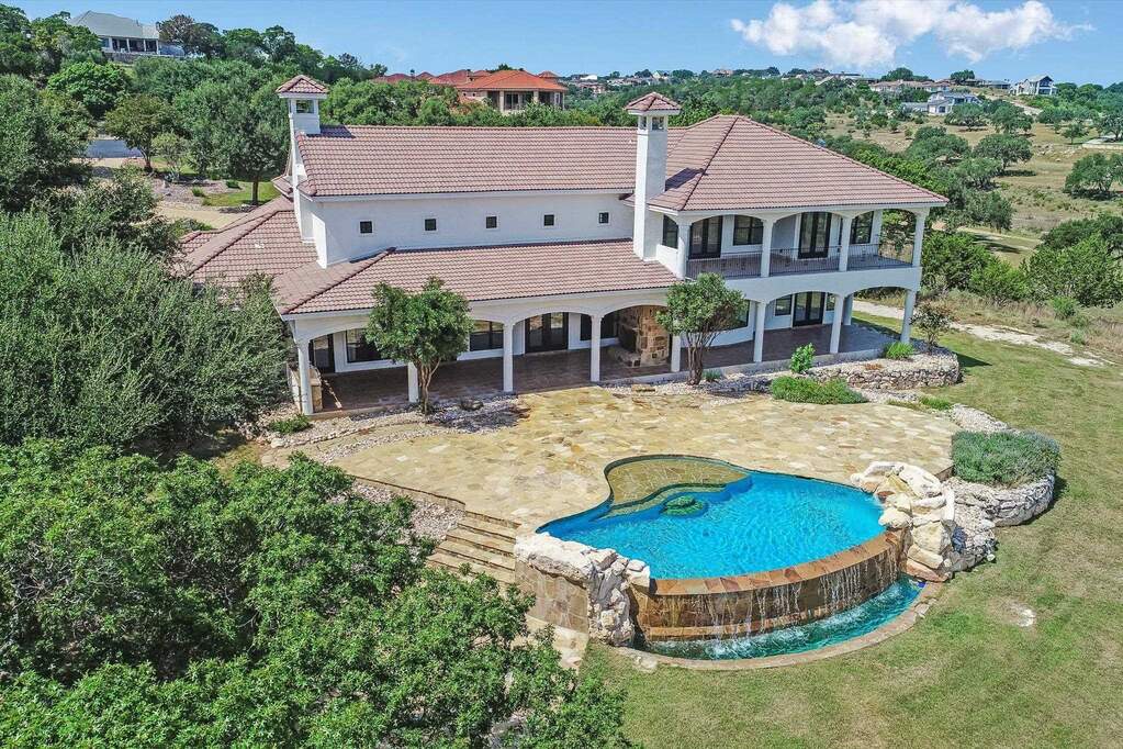 Enjoy panoramic view from multiple patios on back side of home