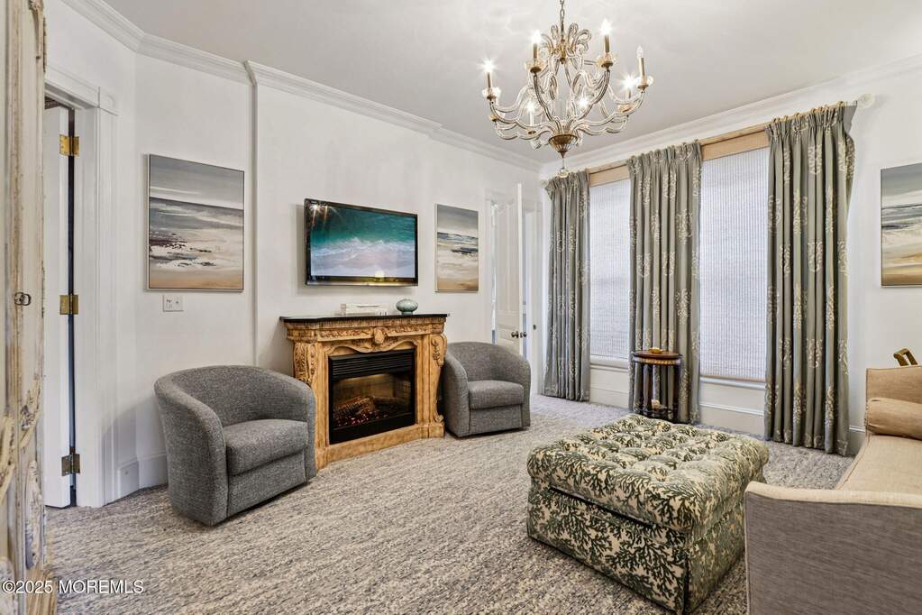 Sold Completely Furnished, Living Area, Electric Fireplace with heating element, Wall hung large flat screen T.V.