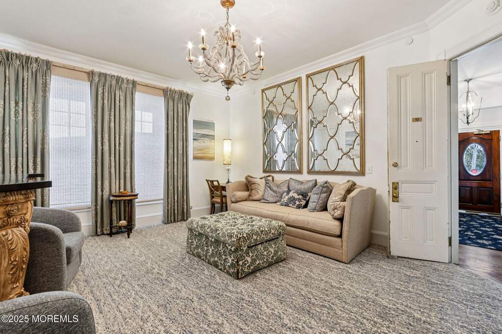 Custom window treatment and lighting, new carpet, decorative wall mirror.
