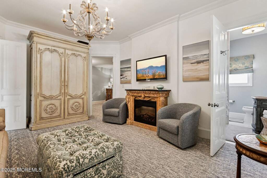 Living Area, Wet Bar in closed Armoire, entrance to full bathroom off living area