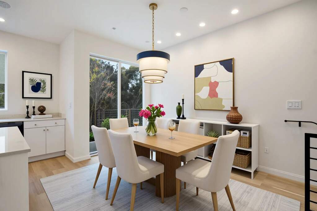 Dining area featuring light wood finished floors and recessed lighting