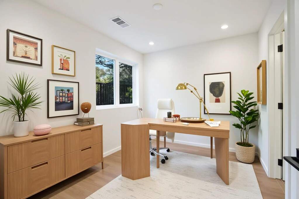 Home office with light wood-type flooring and recessed lighting