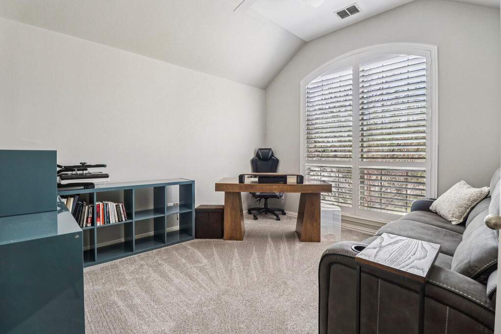 Office area featuring light carpet