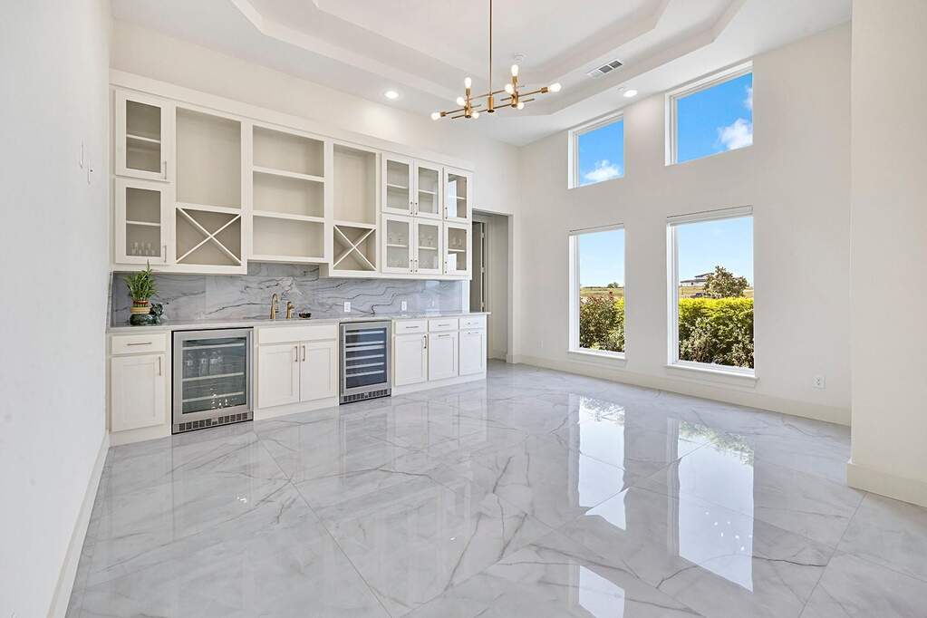Spacious interior with high ceilings and white walls