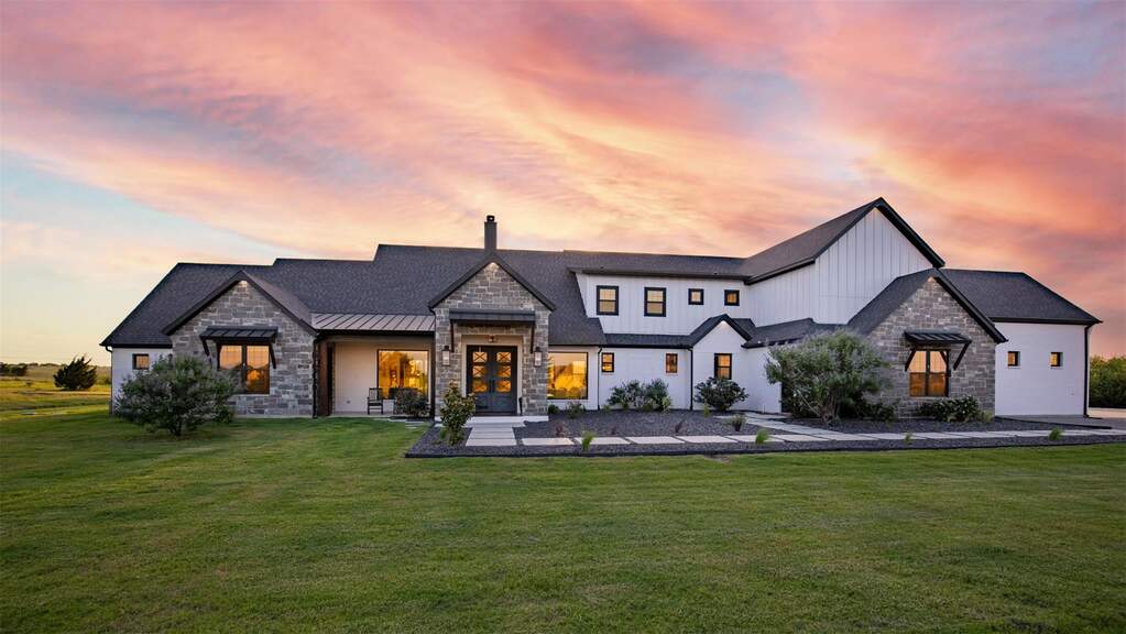 Situated East facing is this contemporary farmhouse architecture featuring stone and board-and-batten siding, elegant concrete paver walkway. Located on 3+ AC in upscale Hills of Lone Star ne