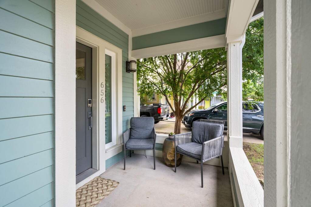 Inviting covered front porch perfect for morning coffee or evening conversations.
