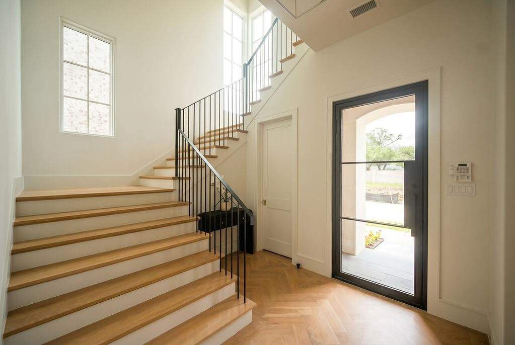 Entry with under staircase storage.