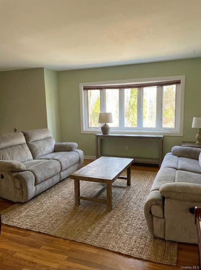 Living room featuring wood finished floors and baseboards