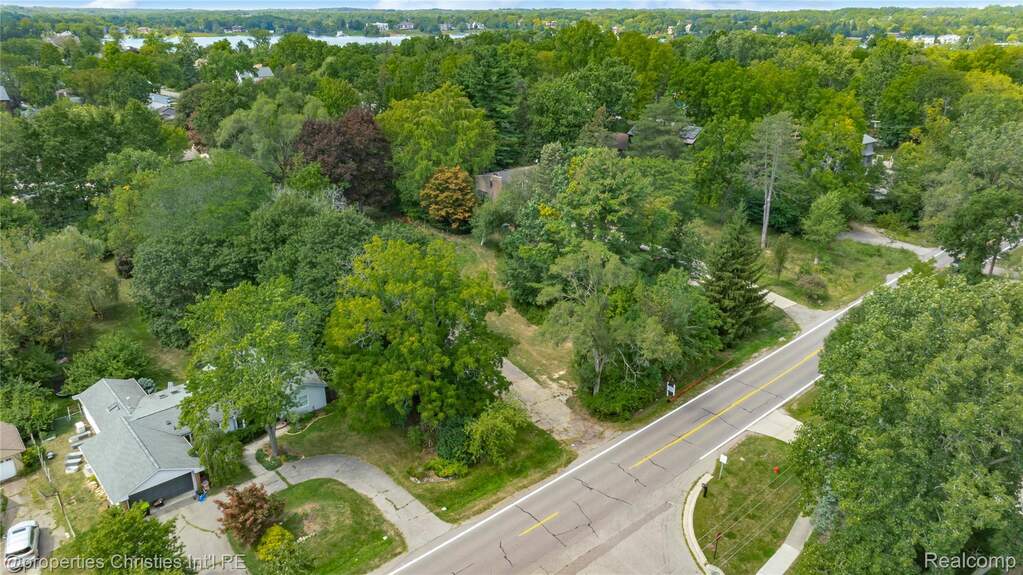 Aerial overview of property's location with a nearby body of water