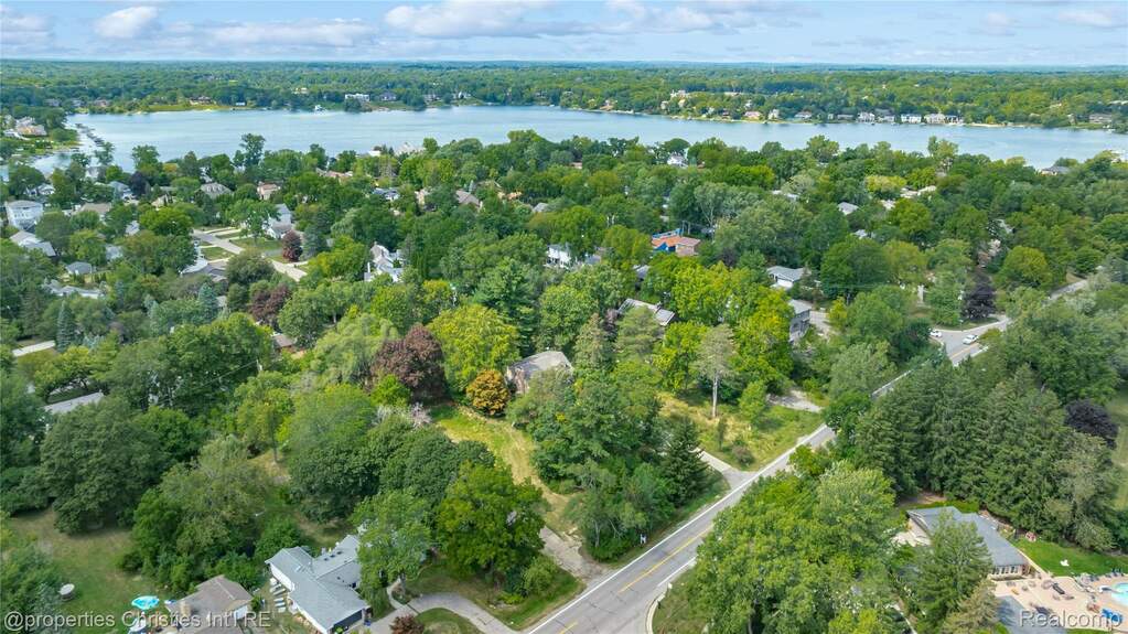 Aerial overview of property's location with a large body of water