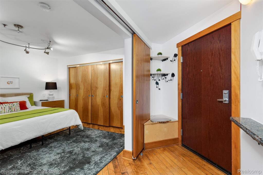 Bedroom featuring a closet and light wood-type flooring