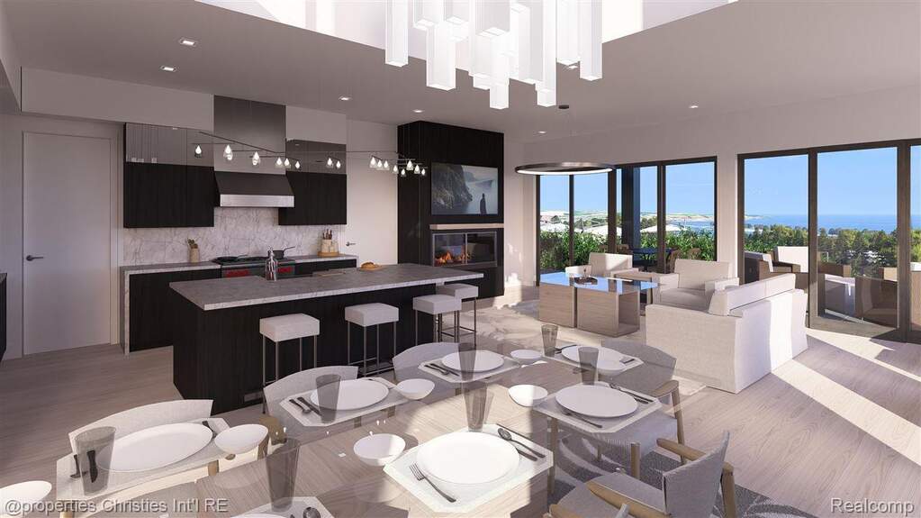 Dining area featuring a fireplace, light wood finished floors, and recessed lighting