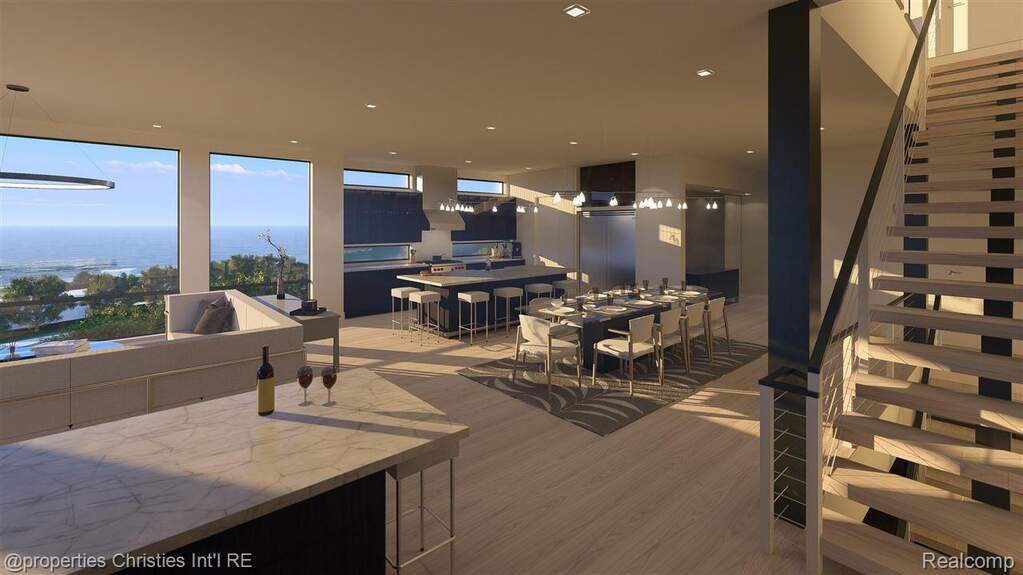 Dining room with stairs, light wood-style floors, and recessed lighting