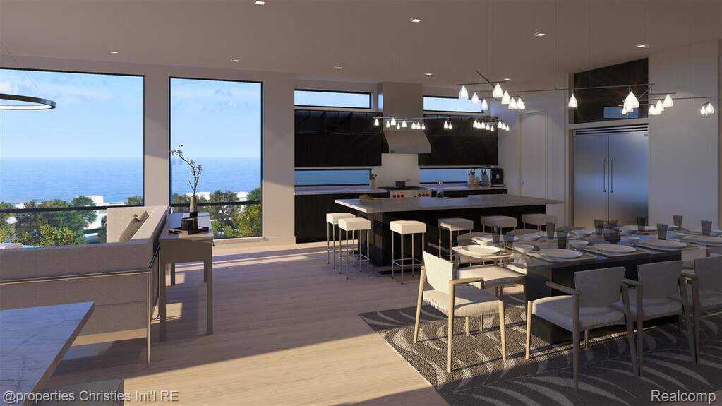 Dining room with light wood-type flooring and recessed lighting