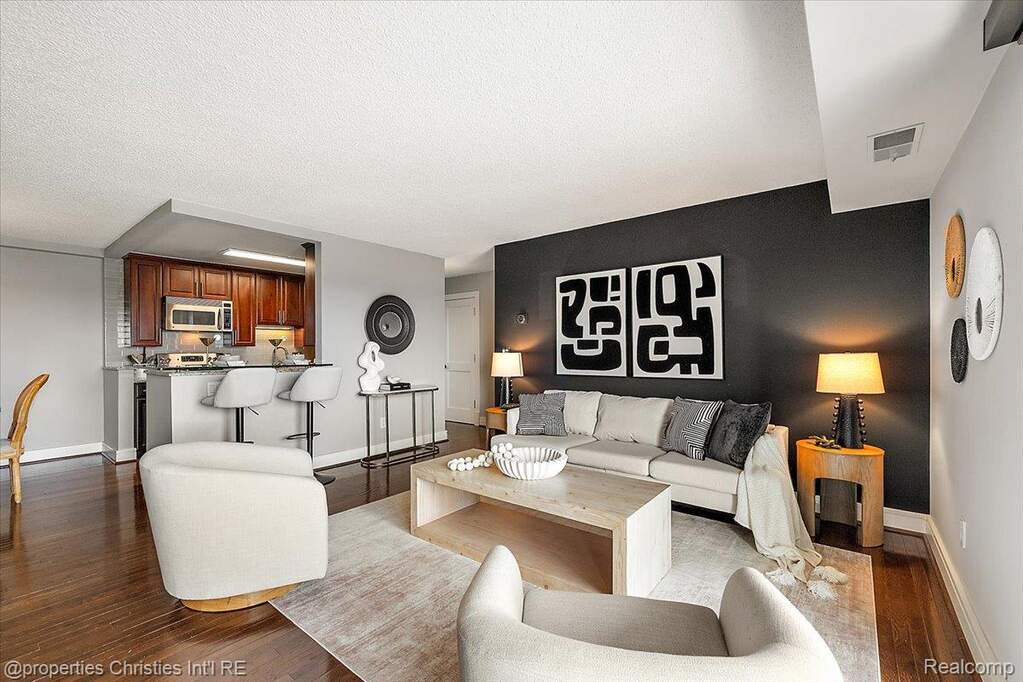 Living room featuring wood finished floors and a textured ceiling