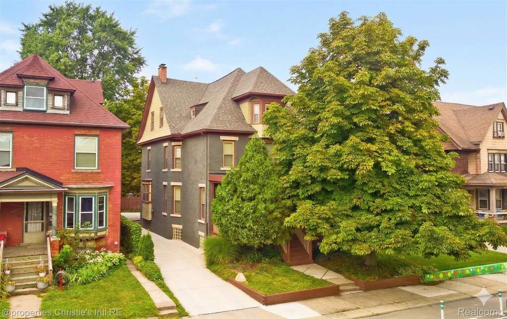 Exterior front of property with front tree in full bloom

