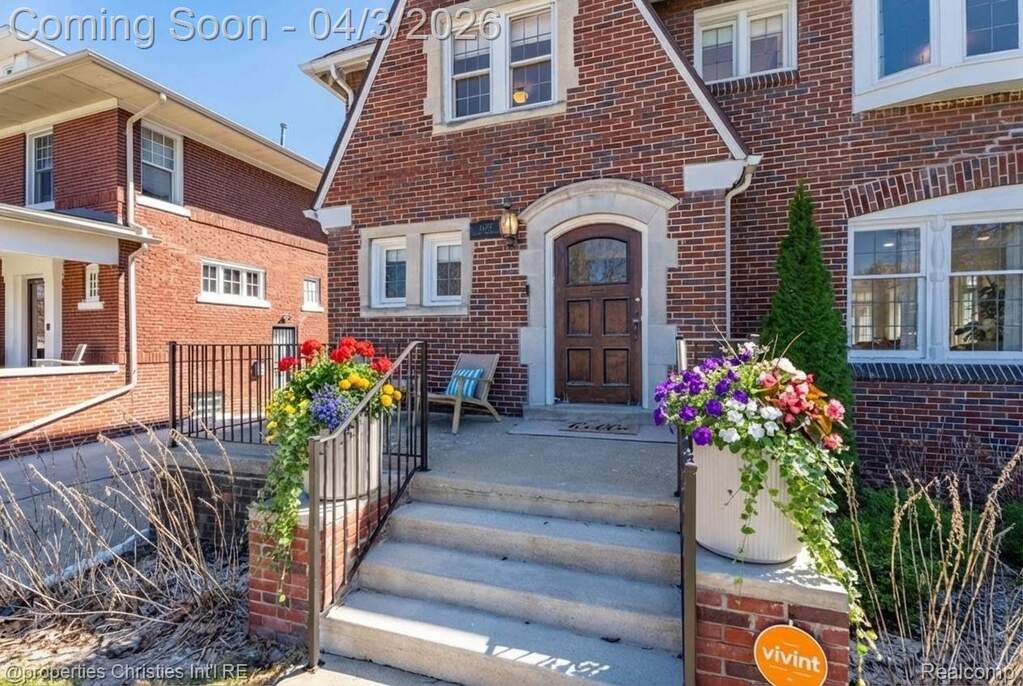 Doorway to property with brick siding