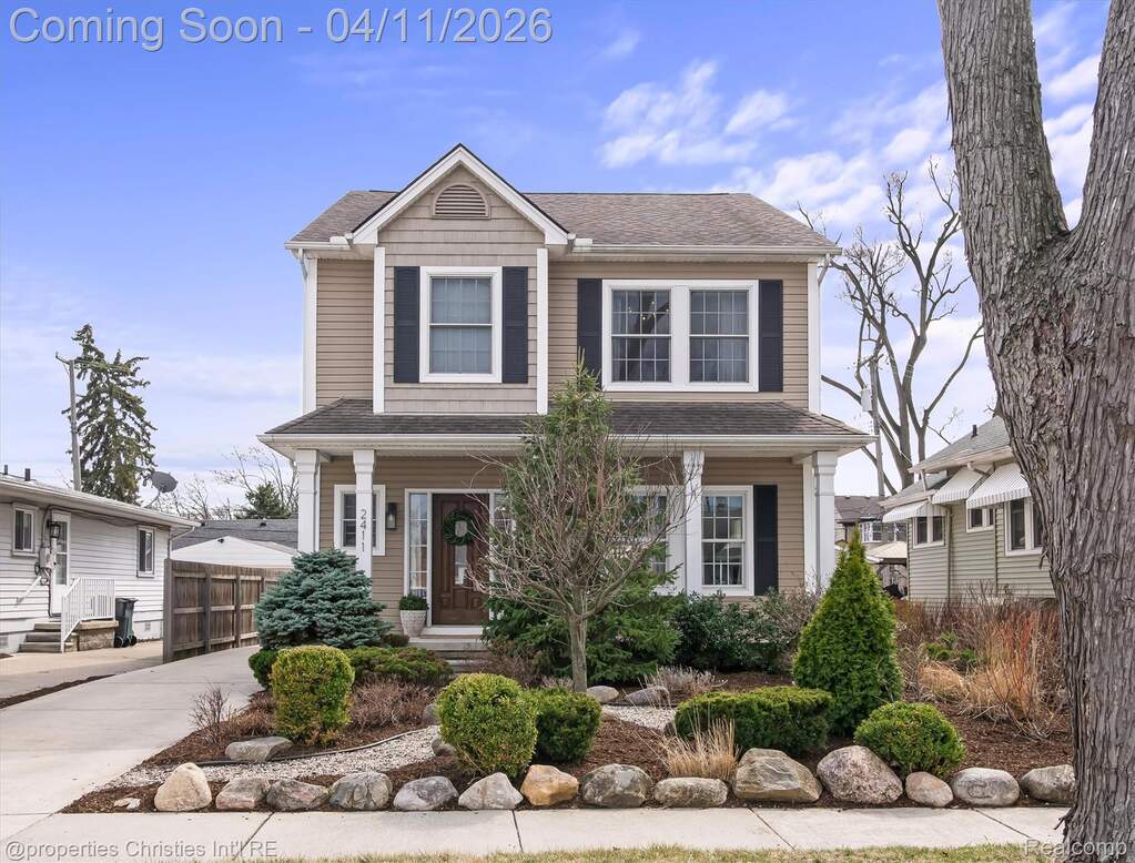 View of front of house with covered porch and a shingled roof
