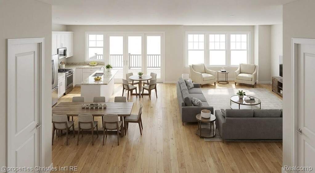 Living area featuring light wood-style flooring and baseboards