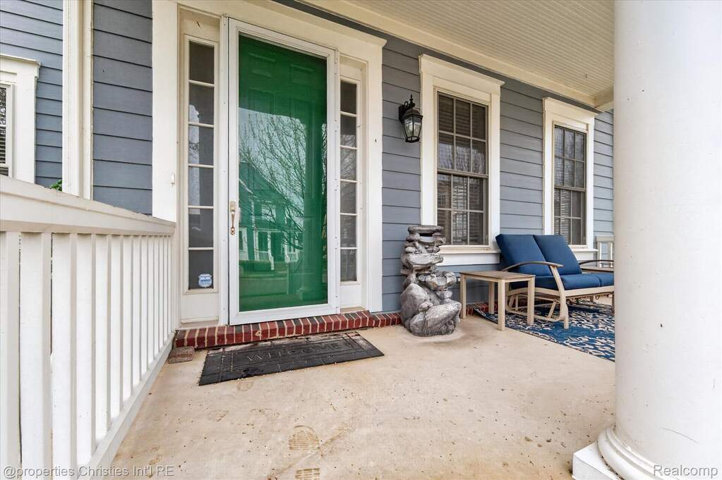 Property entrance featuring covered porch