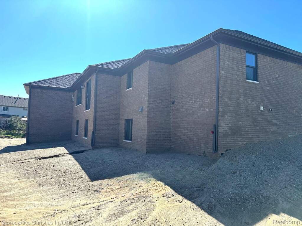 View of side of home with brick siding