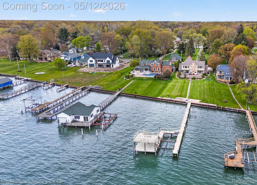 Dock with a water view and a residential view