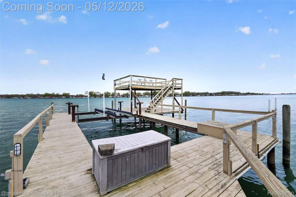 Dock area featuring a water view and boat lift