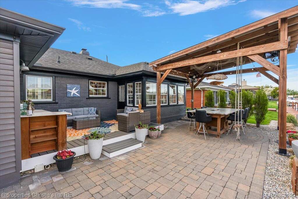 View of patio with outdoor lounge area and a deck