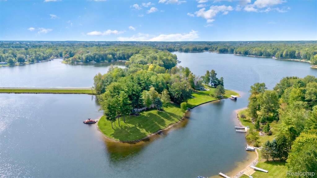 Aerial view of a large body of water and a heavily wooded area