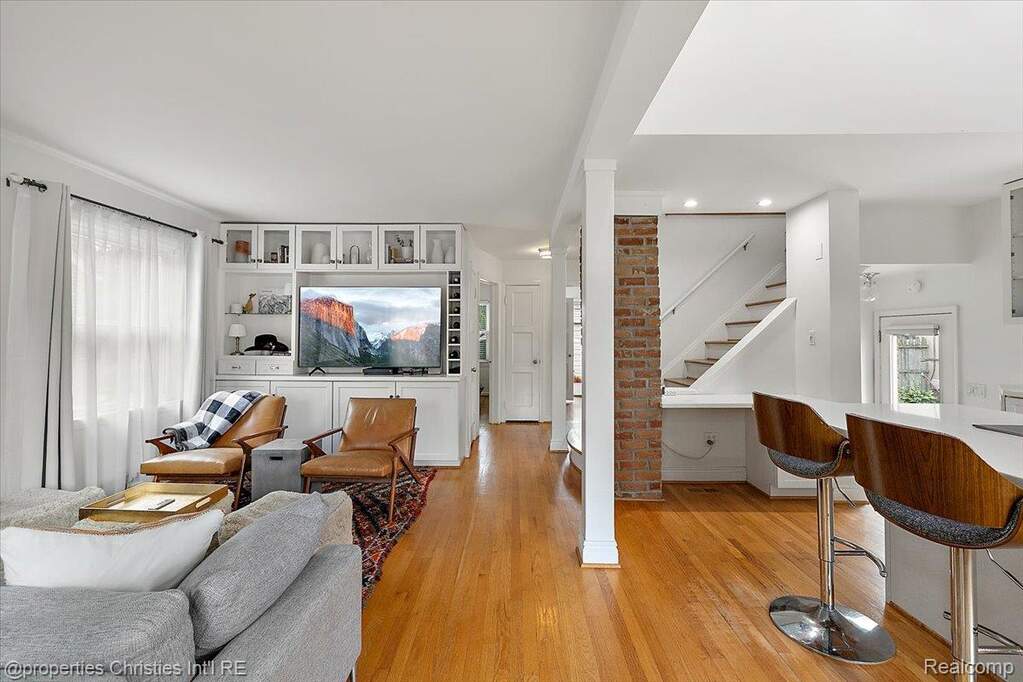 Living area featuring plenty of natural light, light wood-type flooring, and recessed lighting