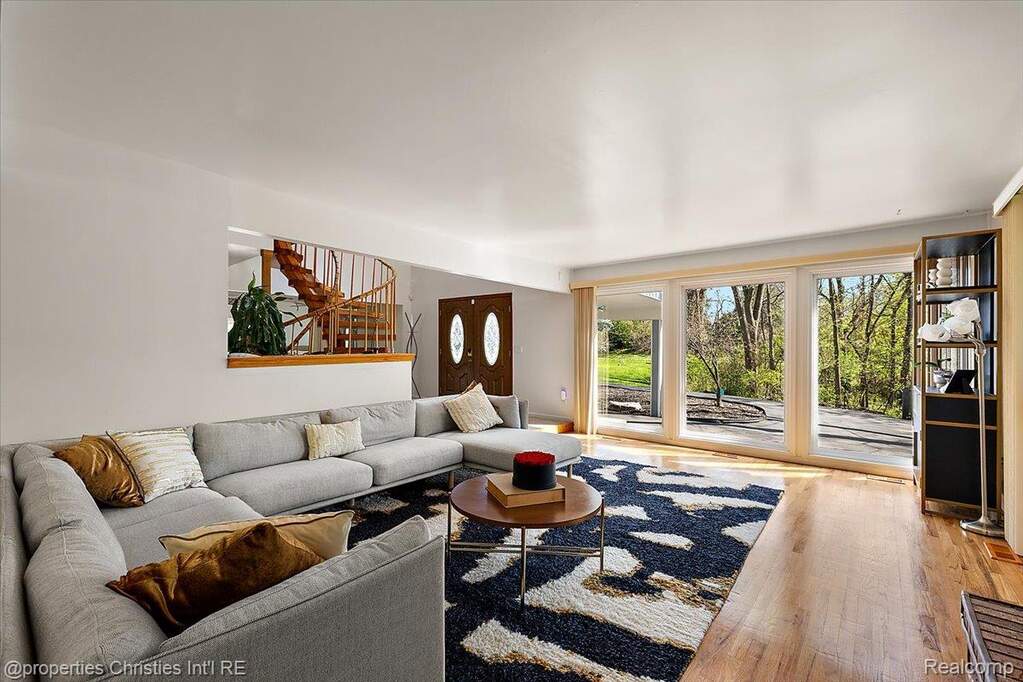 Living area featuring wood finished floors and stairs