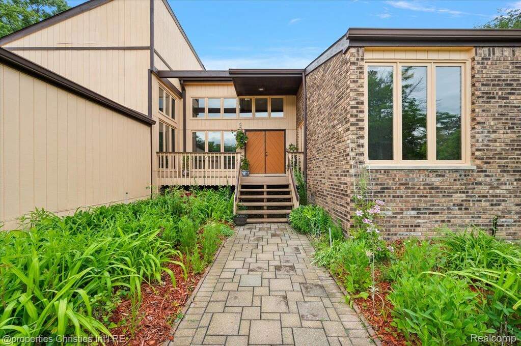 Rear view of property featuring a yard