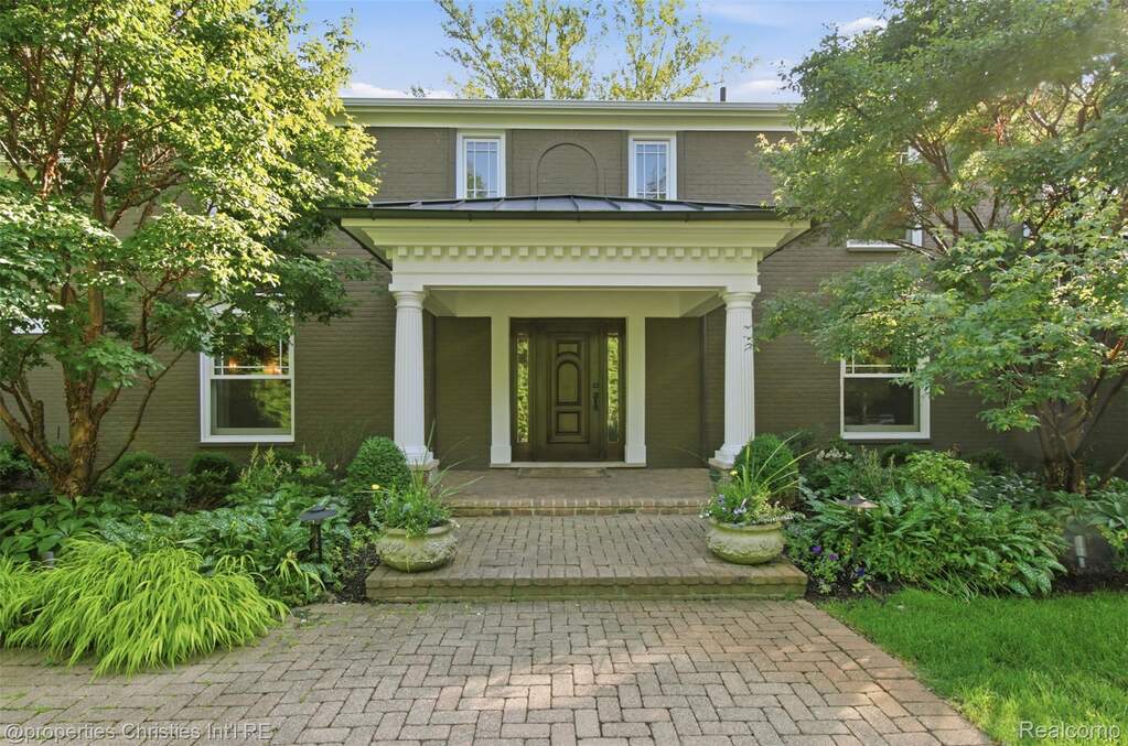 Front entry with lush gardens