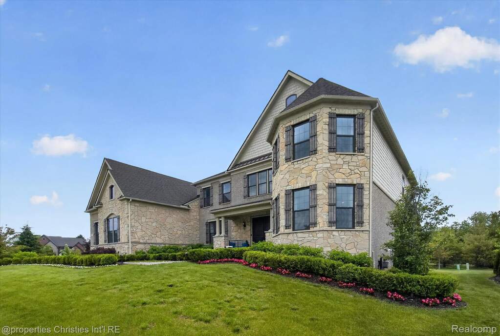 Stone and siding exterior with multiple gables