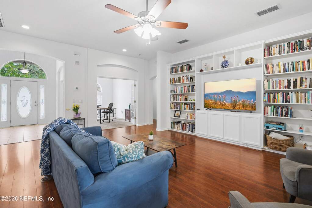 Built in bookcases compliment the high ceilings and elevate the space.