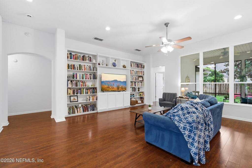 Large windows from the screened porch lets in natural light filling this room.