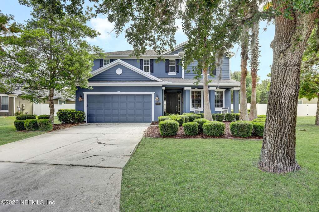 Lovely landscaping, two car garage