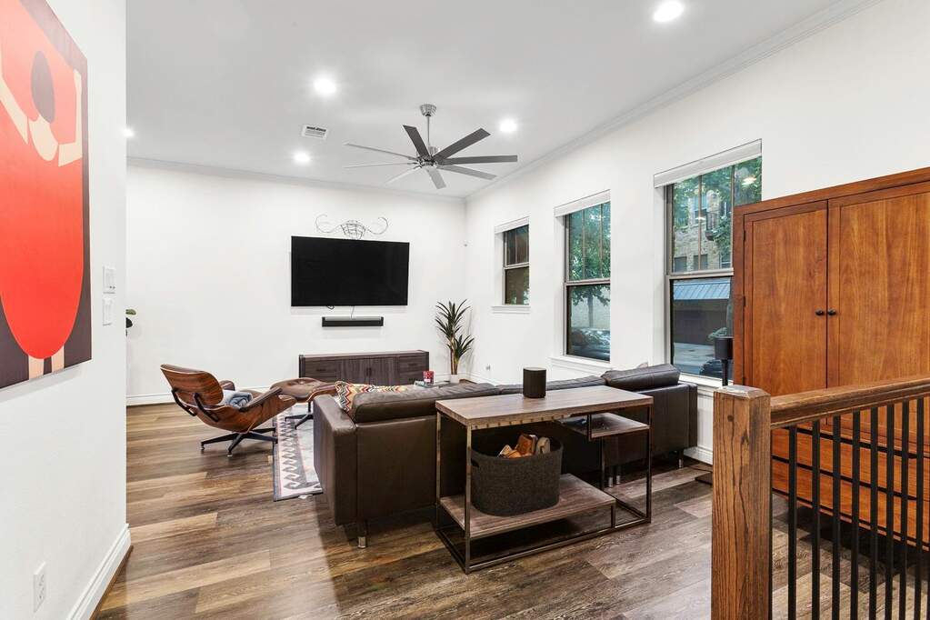 Large living room and entry way, open to dining space and kitchen.