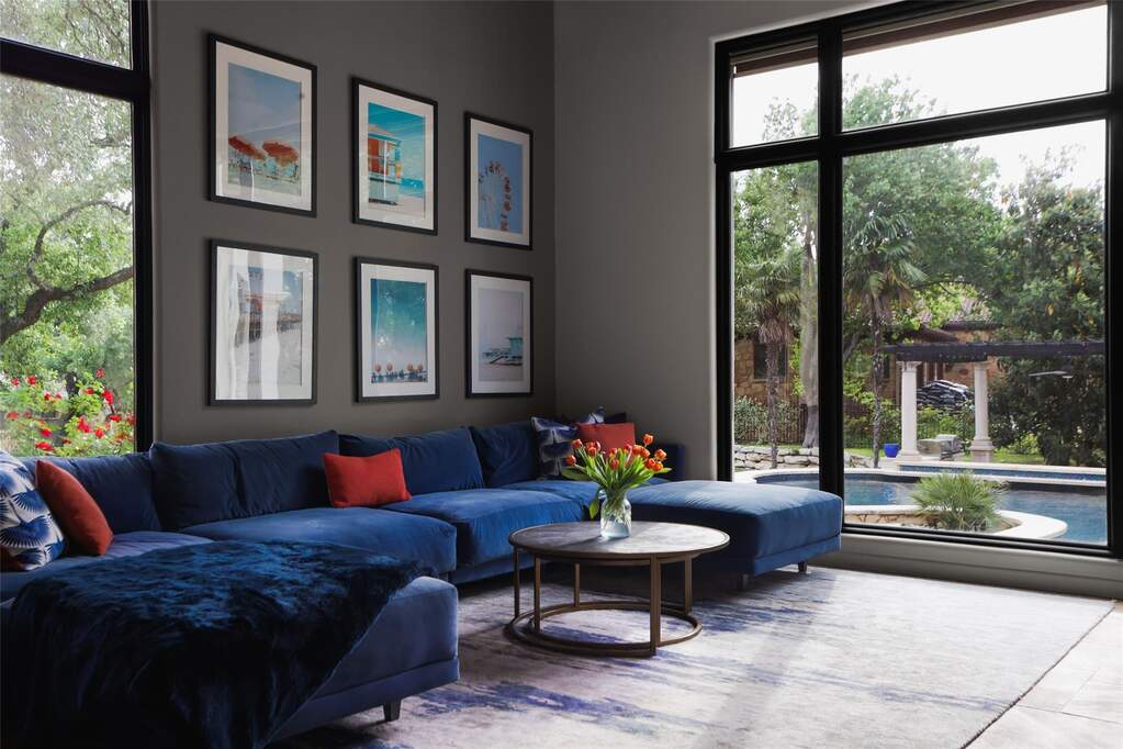Family room looks out to the resort style backyard