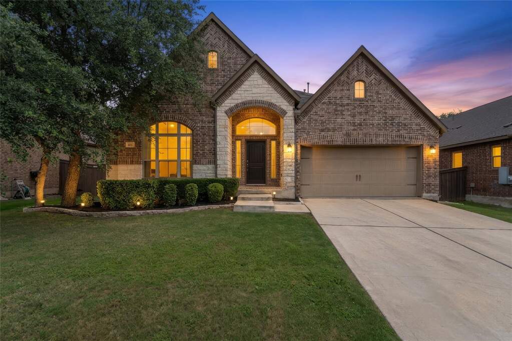 The beautifully landscaped front yard and exterior architecture offer a warm welcome every time you pull into the driveway of this Bryson home