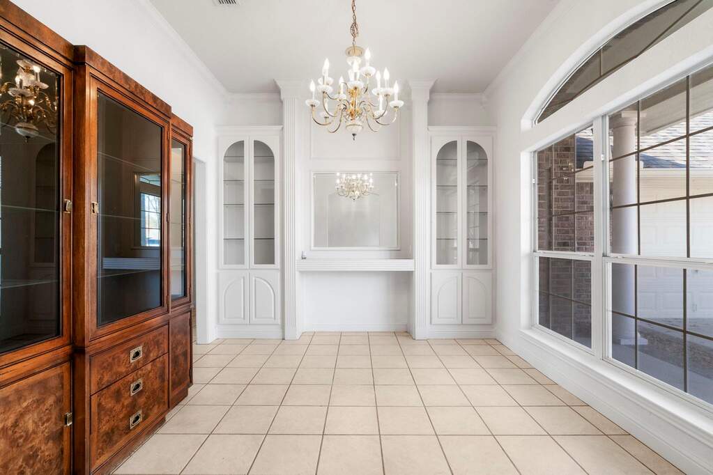 Dining room with built-ins and a chandelier