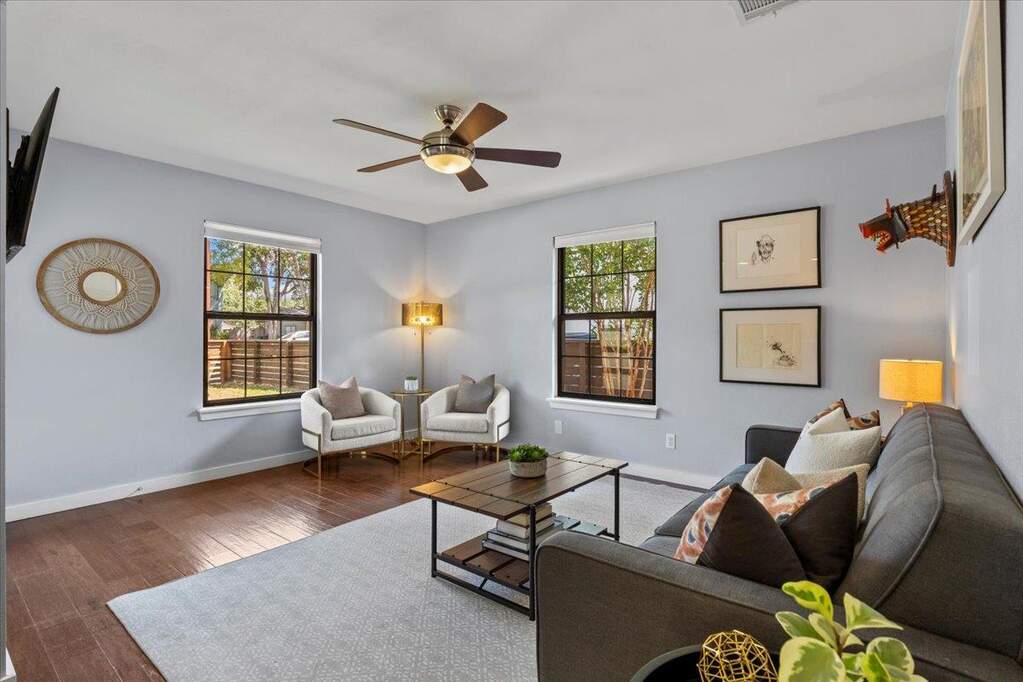 Perfect black-framed windows flood the space with natural light while adding a touch of sophistication and style.