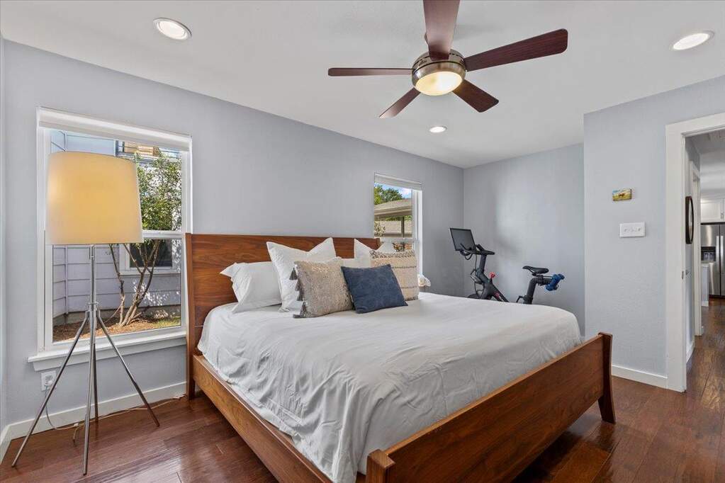 The primary suite is a serene retreat, featuring a generously sized walk-in closet and a spa-like ensuite.