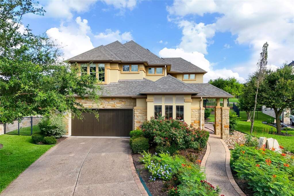 Set within a quiet golf course community with no through traffic, this beautiful residence offers timeless curb appeal, mature landscaping, and direct access to premier neighborhood amenities