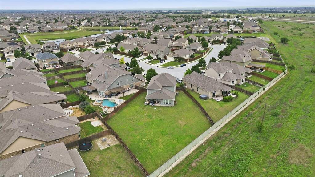 Expansive residential neighborhood featuring numerous single-family homes with gray shingle roofs
