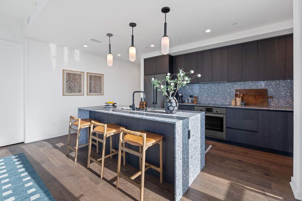 Representative Photo. The residence features the Industrial Rainey scheme which includes Italkraft carbon marine wood Italian cabinetry and terrazzo-quartz countertops, and Bosch stainless st