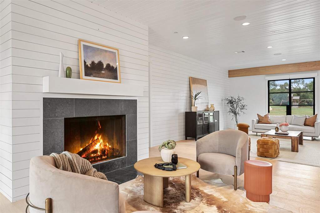 The living room serves as the central gathering space, connecting the entire main level.